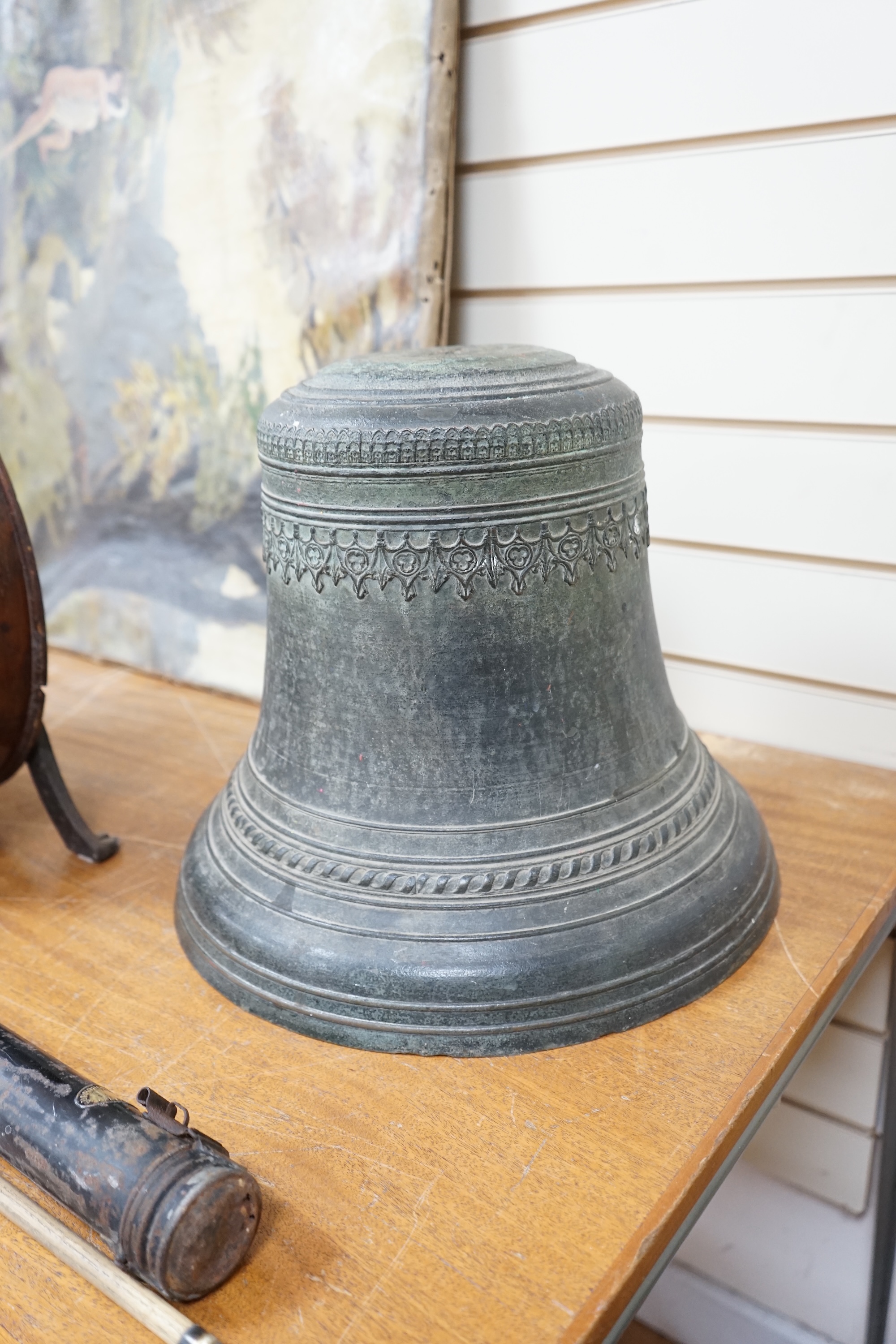 A large Dutch or French cast church bell, 17th/18th century, with decorative Gothic frieze, 33cm high, 40cm diameter. Condition - fair, the crown has been ground off the top.